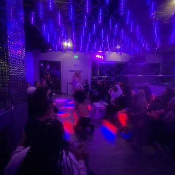 Luv SF - a group of people sitting in a dimly lit room - Dance Clubs Near Me - San Francisco, California