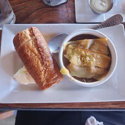 French onion soup with a baguette and butter French onion soup with a baguette and butter