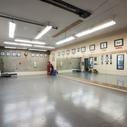 Wudang Internal Martial Arts Academy - Martial Virtues that our school values (characters above the mirrors and on the wall)