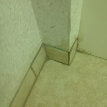 Microtel Inn by Wyndham Onalaska/La Crosse - Bathroom tile in need of grout. - Hotels Near Me - Onalaska, Wisconsin