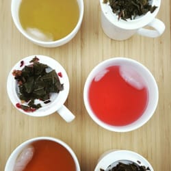 Dominion Tea - A study in contrast. Iced Darjeeling, Hibiscus Isle, and Tropical Blossom Green.