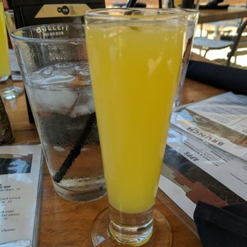 The Vig Fillmore - Mimosa, with regular sized water glass in the back for comparison - New American Near Me - Phoenix, Arizona The Vig Fillmore - Mimosa, with regular sized water glass in the back for comparison - New American Near Me - Phoenix, Arizona