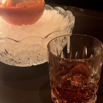 Carbone - My First and Now my Favorite drink. Negroni. Candied grapefruit with cucumber sorbet.. - Italian Near Me - Las Vegas, Nevada
