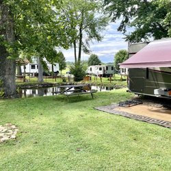 Tana-See Campground - Our campsite, along with others in the background,pond, and dog park.
