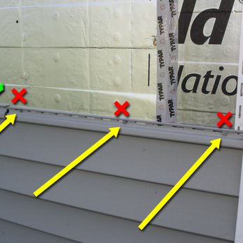 Hometown Home Improvement - the side of a house with siding taped to the side of the house - General Contractors Near Me - Saco, Maine Hometown Home Improvement - the side of a house with siding taped to the side of the house - General Contractors Near Me - Saco, Maine