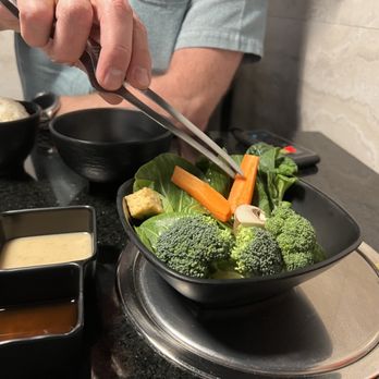 Shabushi - a person chopping broccoli and carrots - Japanese Near Me - Pocatello, Idaho Shabushi - a person chopping broccoli and carrots - Japanese Near Me - Pocatello, Idaho