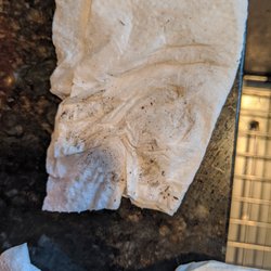 Royale Vacation Rentals - Dirt on floor under table that I wiped up after cleaners came over to clean.