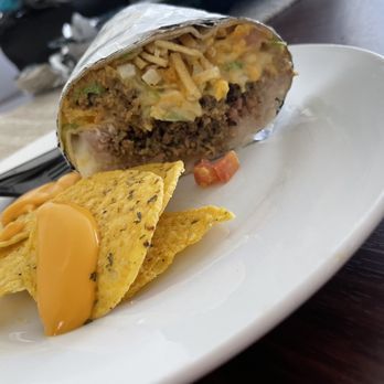 Tropical Flavor - a burrito and chips on a plate - Puerto Rican Near Me - Haines City, Florida Tropical Flavor - a burrito and chips on a plate - Puerto Rican Near Me - Haines City, Florida