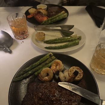 Morton's The Steakhouse - Dry-aged ribeye, lobster tail, grilled shrimp, and asparagus - Steakhouses Near Me - Boston, Massachusetts