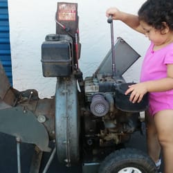 The Lawnmower Shop - Disassemble and overhaul the carburetor underneath the air cleaner assembly I'm touching with my left hand.