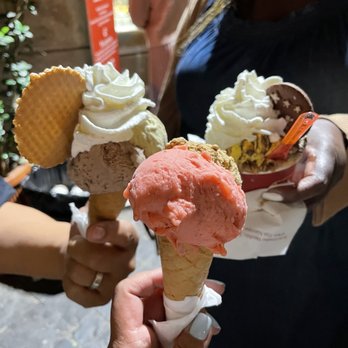 Frigidarium - Strawberry&coffee up front, hazelnut&pistachio w/whip and a cookie on the left, chocolate with cocoa powder w/whip and a cookie on the right - Ice Cream & Frozen Yogurt Near Me - Rome, RM