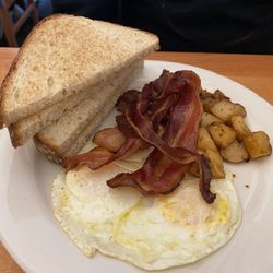 Eggs over medium, not crispy bacon , home fries and no hash browns