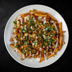 Fried seasoned fries piled high with rich nacho cheese, your choice of meat, jalapeños, guacamole sauce, sour cream, cilantro and onions.