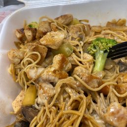 a close up of a bowl of noodles with chicken and broccoli a close up of a bowl of noodles with chicken and broccoli
