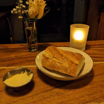 Webster’s Wine Bar - a plate of bread and a bowl of butter - Wine Bars Near Me - Chicago, Illinois Webster’s Wine Bar - a plate of bread and a bowl of butter - Wine Bars Near Me - Chicago, Illinois