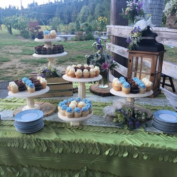 Fat Cupcake - Extras on separate table. There were 300 minis. The picture makes the frosting look blue, but is was a beautiful lavender. - Cupcakes Near Me - Oregon City, Oregon Fat Cupcake - Extras on separate table. There were 300 minis. The picture makes the frosting look blue, but is was a beautiful lavender. - Cupcakes Near Me - Oregon City, Oregon