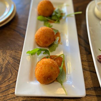 FolkArt - GRIT FRITTERS - House made grits with cheddar cheese and jalapeños, deep fried and served with house made peach-habanero jam. - American Near Me - Decatur, Georgia