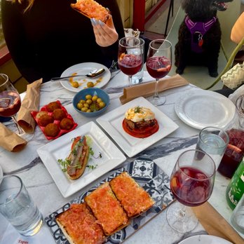 El Born - Happy hour! Top to bottom: olives, croquetas, Patatas bravas, pintxo de sardines, pa amb tomaquet Drinks: sangria - Spanish Near Me - Brooklyn, New York