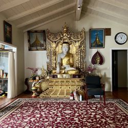 Burma Buddhist Temple - Intimate prayer room with a golden Buddha altar, having fostered peaceful, personal moments between monks, guests, and Dharma.