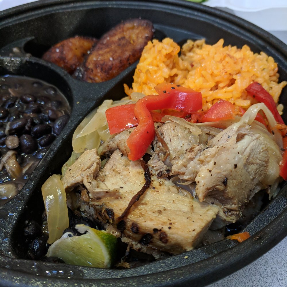Beni’s Cubano - Downtown - Puerco Asado. Mojo-marinated pork with grilled onions and peppers and lime. Served with yellow rice, black beans, and sweet plantains. $13. - Cuban Near Me - Atlanta, Georgia