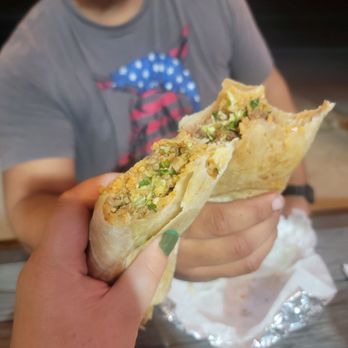 Yanez Tacos - a man holding a taco - Food Trucks Near Me - Tulare, California Yanez Tacos - a man holding a taco - Food Trucks Near Me - Tulare, California