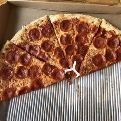 Pizza Hut - Half eaten Big New Yorker with pepperoni. Was hungry!!!! Yum!!!