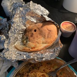 Roma's Italian Restaurant - Sausage, pepperoni, and jalapeño calzone... along with Chicken Milaneze...