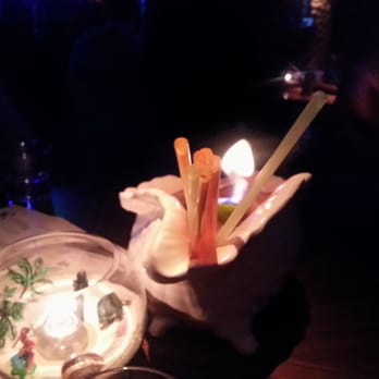 Three Dots and A Dash - Bad pic but its one of those seashell drinks and a shot of the cool centerpiece. - Asian Fusion Near Me - Chicago, Illinois Three Dots and A Dash - Bad pic but its one of those seashell drinks and a shot of the cool centerpiece. - Asian Fusion Near Me - Chicago, Illinois