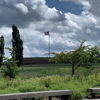 Fort McHenry - Looking at the fort and American flag from the parking lot. - Landmarks & Historical Buildings Near Me - Baltimore, Maryland