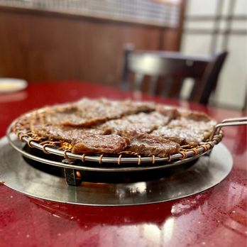 San Soo Kap San - a pan of food on a table - Korean Near Me - Queens, New York San Soo Kap San - a pan of food on a table - Korean Near Me - Queens, New York