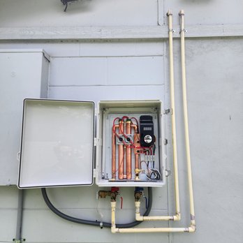 Plumbing Therapist - We had to get creative and adapted the inside of the Tankless into this water tight box, since the Tankless cannot be installed outside. - Plumbing Near Me - Tampa, Florida Plumbing Therapist - We had to get creative and adapted the inside of the Tankless into this water tight box, since the Tankless cannot be installed outside. - Plumbing Near Me - Tampa, Florida