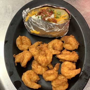 Backwoods Steak House - a plate of chicken nuggies and a baked potato - Steakhouses Near Me - Tallapoosa, Georgia Backwoods Steak House - a plate of chicken nuggies and a baked potato - Steakhouses Near Me - Tallapoosa, Georgia