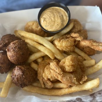 Windy Corner Market - Fried shrimp, fries & hush puppies with in house made tarter. - American Near Me - Lexington, Kentucky Windy Corner Market - Fried shrimp, fries & hush puppies with in house made tarter. - American Near Me - Lexington, Kentucky