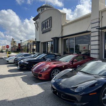 Post Kitchen and Bar - a row of sports cars parked in front of a restaurant - New American Near Me - Bradenton, Florida