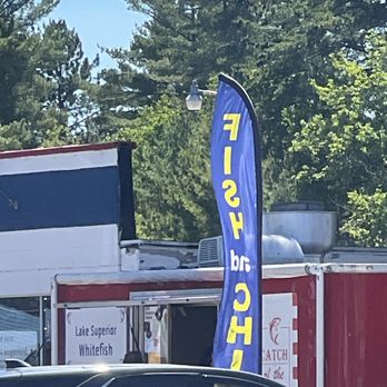 Catch of The Day - Flag in front of - Food Trucks Near Me Catch of The Day - Flag in front of - Food Trucks Near Me