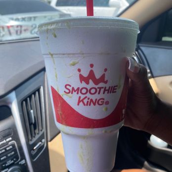 Smoothie King - a hand holding a cup of smoothie - Health Markets Near Me - Houston, Texas