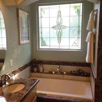 Hired Hand Construction - a bathroom with a large tub - General Contractors Near Me - Castaic, California