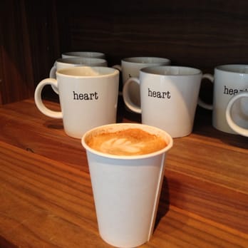 Heart Roasters - Cappuccino in front of a Heart coffee swag. - Coffee & Tea Near Me - Portland, Oregon Heart Roasters - Cappuccino in front of a Heart coffee swag. - Coffee & Tea Near Me - Portland, Oregon