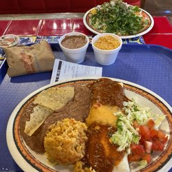 A number 10 and a beef tostada with a side of rice and beans.