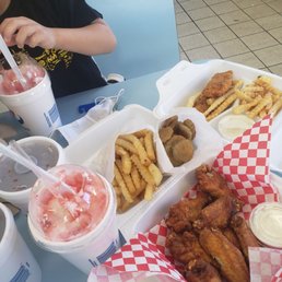 Chicken Wings, Fries, Fried Pickles, Chicken Tender kids meal and Slushie w/ice cream.