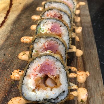 Culichi Town - a sushi roll on a cutting board - Mexican Near Me - Bell, California