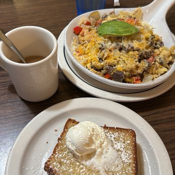 Fiesta skillet,no olives mushroom instead.eggs scrambled and country potatoes.with banana bread as side