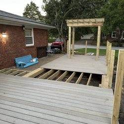 The Decksperts - This is after my neighbor help fill in the blanks because it was dangerous.