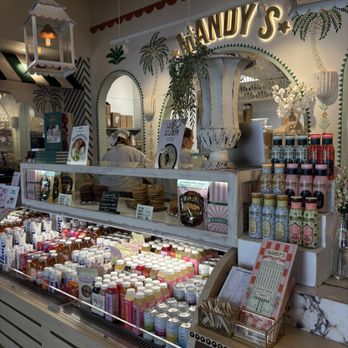 Mandy's - Counter with drinks, cookies, and snacks at Mandy's Yorkville, Toronto, featuring decorative signage and staff in the background. - Salad Near Me - Toronto, Ontario