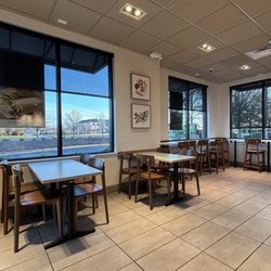 Panera Bread - Dining room with short tables and counter seating at the windows