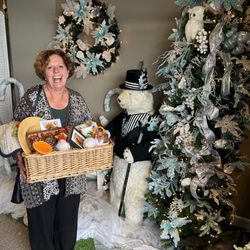 Timeless Treasures Boutique - Customer with basket in front of beautiful TTB Christmas Tree decor