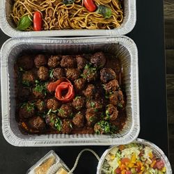 The Baker Camel - Kofta with red sauce and spaghetti and salad with dressing and baklava filled with walnuts