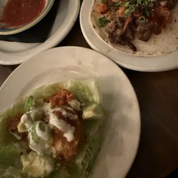 Buffalo cauliflower taco on lettuce wrap and Korean beef taco on flour tortilla