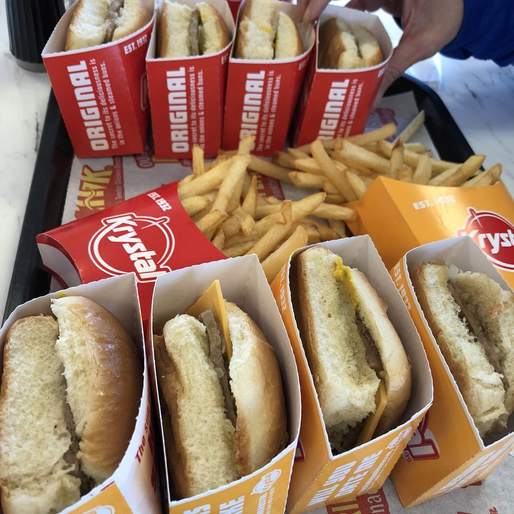 a tray of hot dogs and french fries a tray of hot dogs and french fries