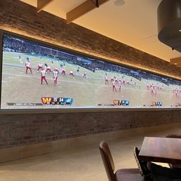 Large TV screens along one wall Large TV screens along one wall